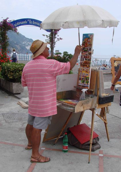 Schilder op strand Positano
